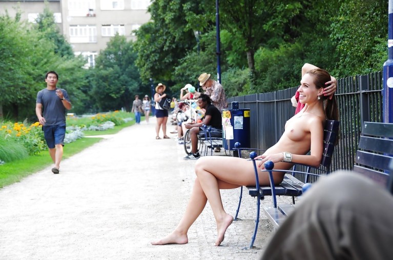 Naked woman on a park bench