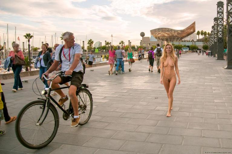 Naked woman walking outdoors