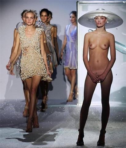 Naked model in wide brimmed hat and heels