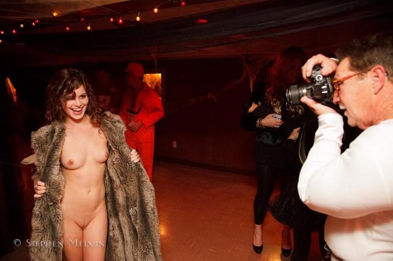 Naked woman in a fur coat